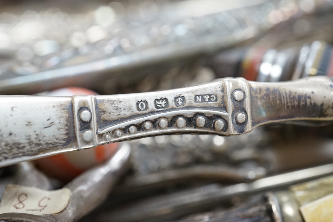 A large collection of Victorian button hooks, with silver, plate, mother of pearl and other handles